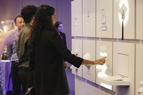 Woman pointing at a wall