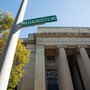 A street sign in front of MIT's 77 Massachusetts Ave entrance